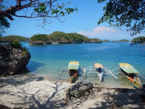 Medium, Small and Big Boats waiting for island hopping tourists (docked at Governor's Island)