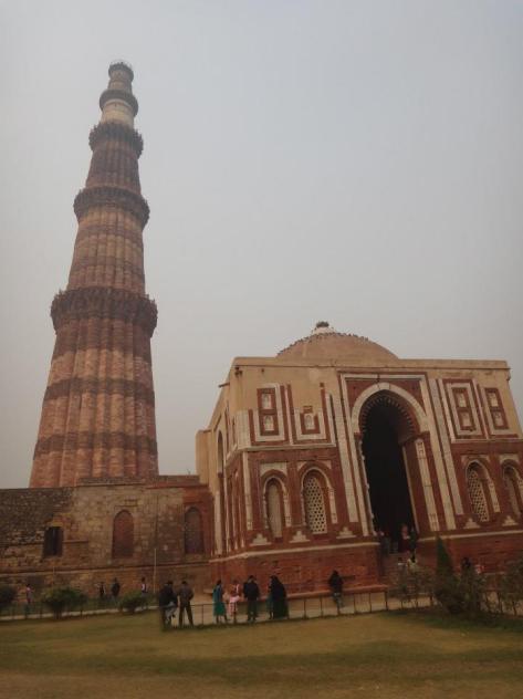 Qutb Minar and Alai Darwaza, entrance gate to the Quwwatu'l-Islam Mosque