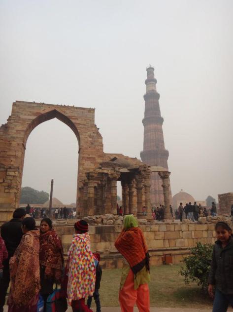 Ruins of Quwwatu-ul-Islam Mosque with Qutub Minar at the background