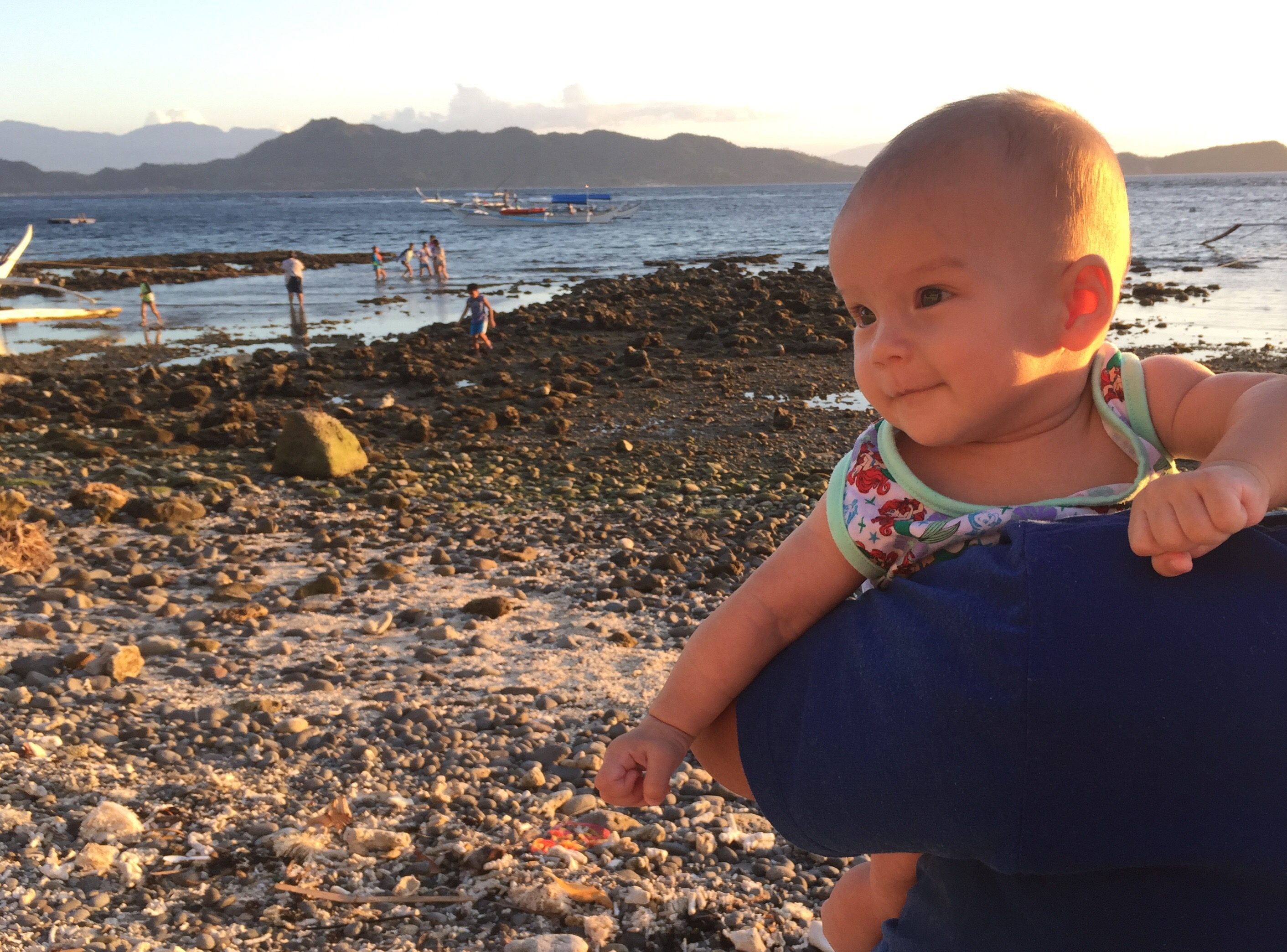 little Tara Freya, enjoying the morning sun by the Balayan Bay in Mabini, Batangas